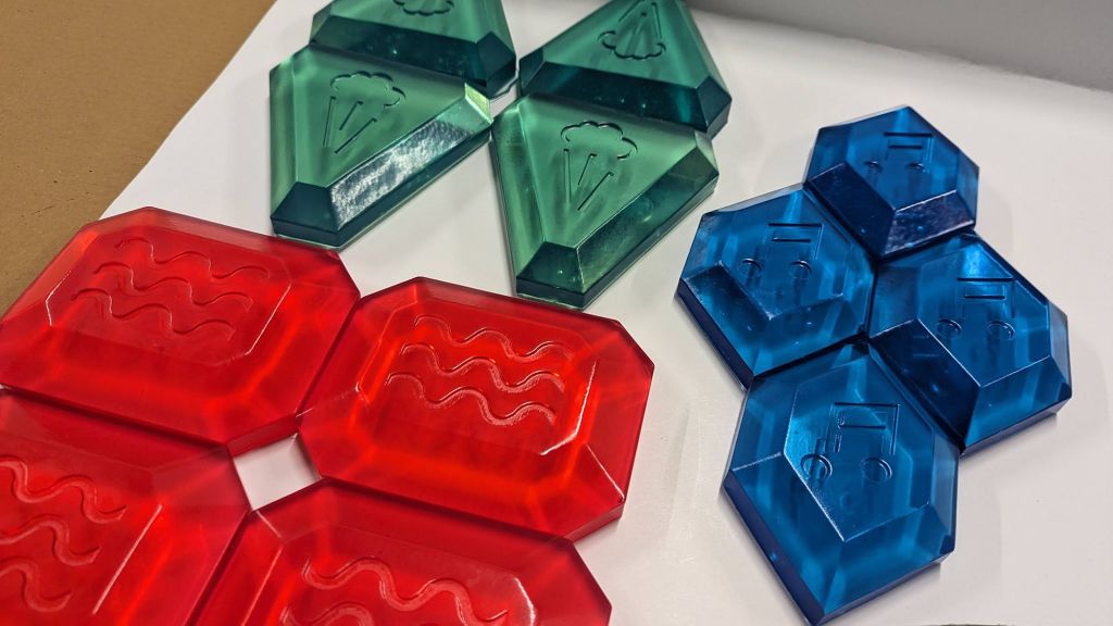 Completed resin MagiQuest rune set in blue, red, and green with symbols