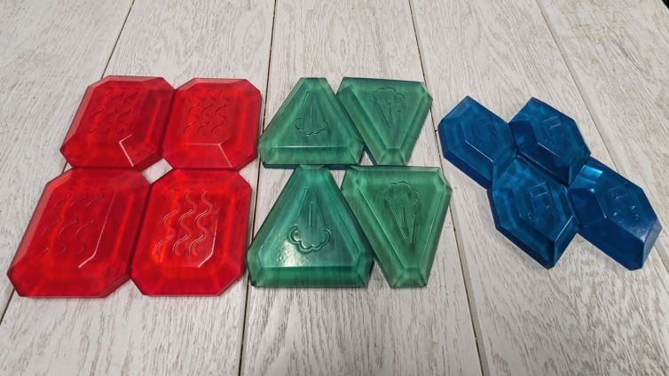 Twelve MagiQuest gemstone runes in red, green, and blue