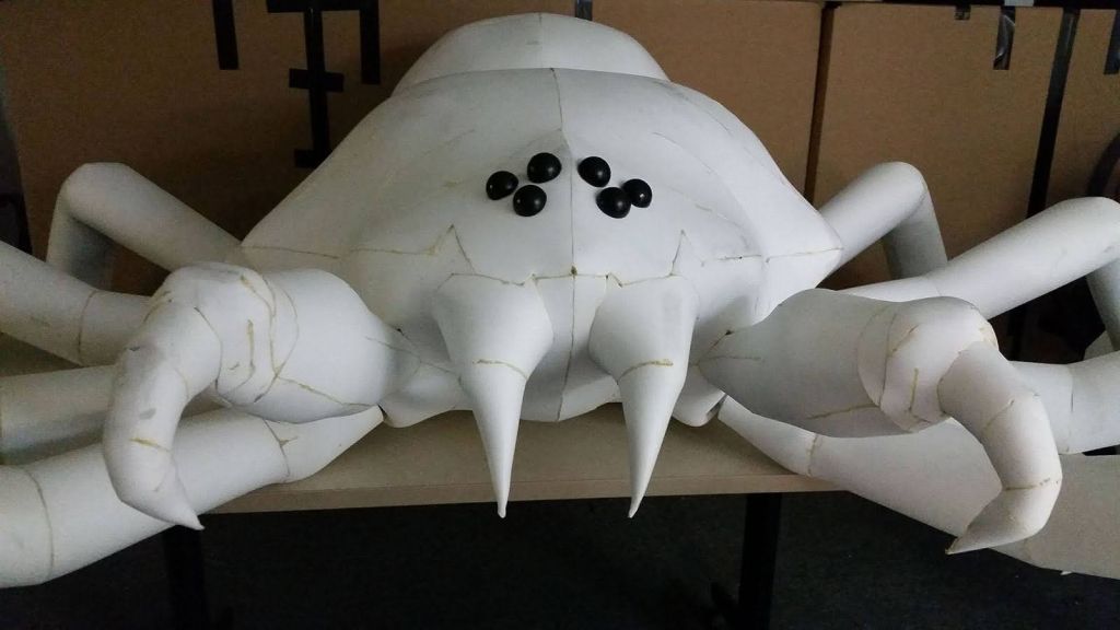 Foam fabrication of giant spider head with fangs