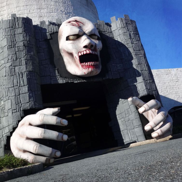 Giant zombie head and hands facade and photo-op