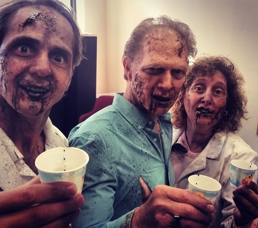 Drippy zombie actors freshening up their mouth goo