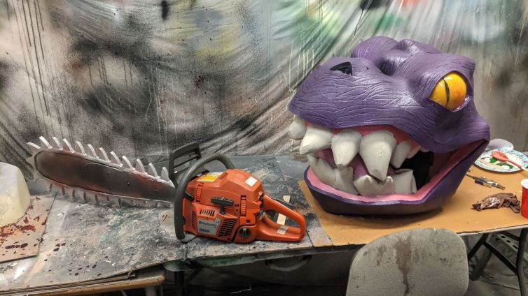 T-Rex head, and customized chainsaw prop