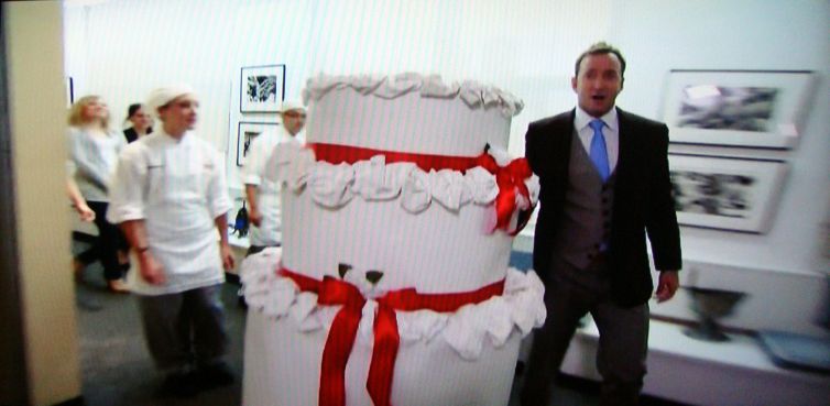 Screengrab: Clinton Kelly wheels in the cake