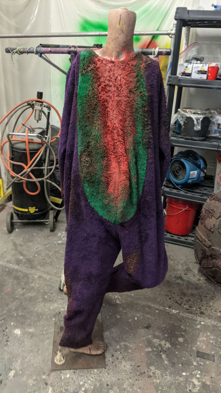 Bloodied and distressed Barney the Dinosaur costume