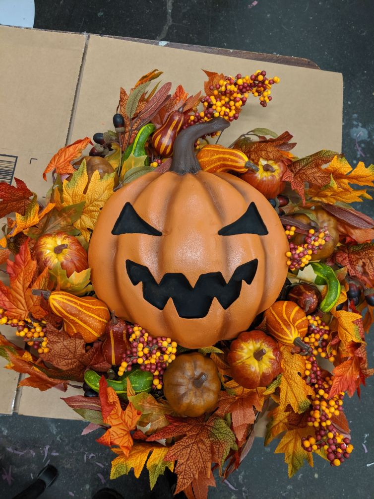 Attaching pumpkins to Fall themed wreaths