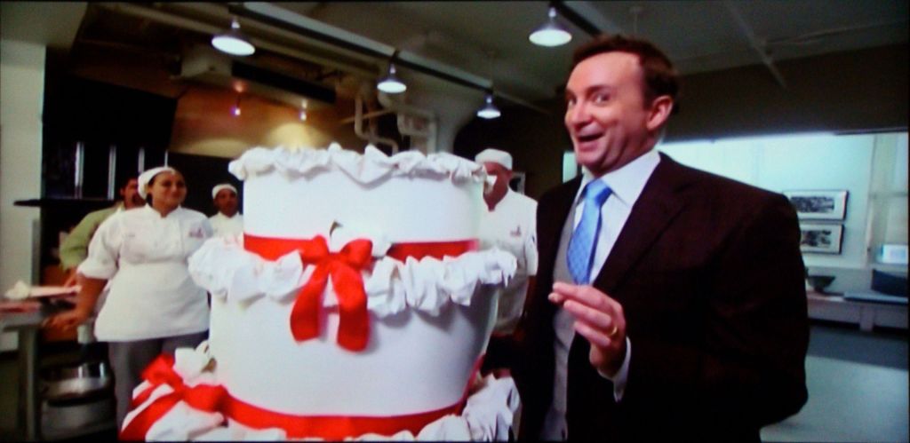 Screengrab: Clinton Kelly wheels in the cake