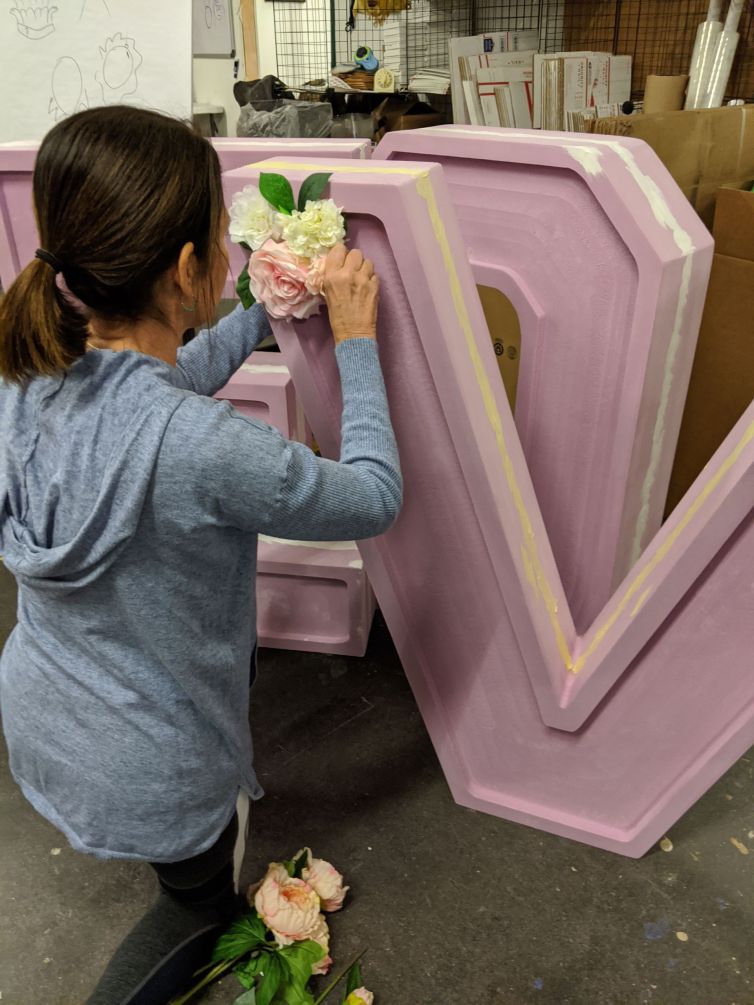 Flower testing the giant foam LOVE signage