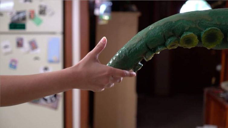 Slimy handshake tentacle screen grab