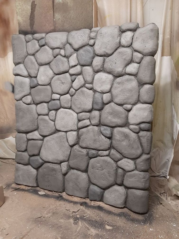 Hard-coating and painting faux stone walls