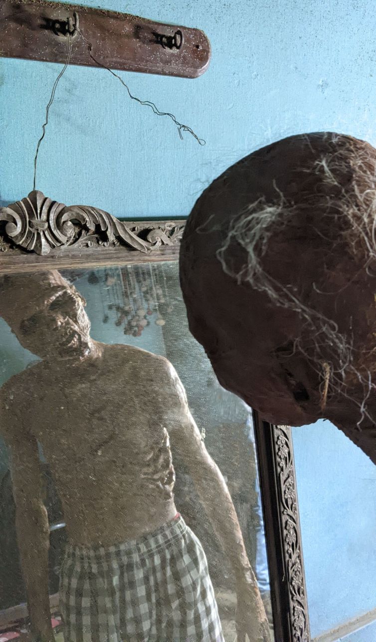 Ancient rotting prosthetic makeup in mirror