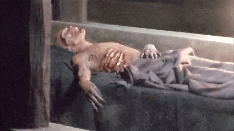 Prosthetic rotting old corpse GIF