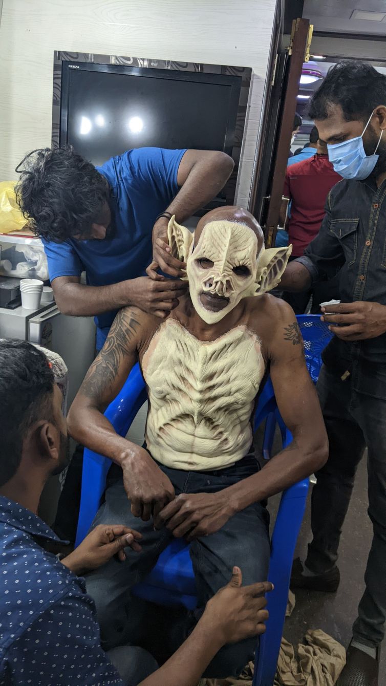 Makeup team applies Gari Devan prosthetics