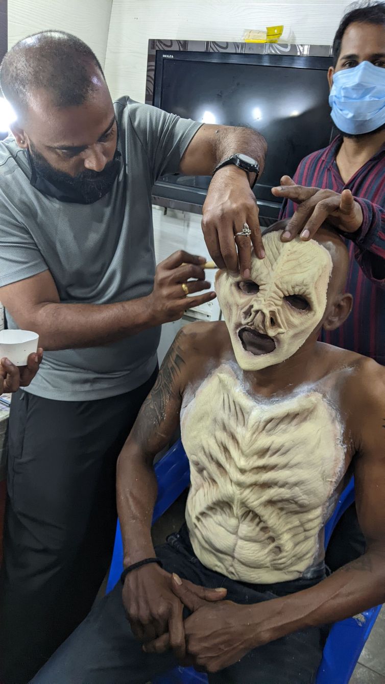 Amal Chandran applies Gari Devan prosthetics