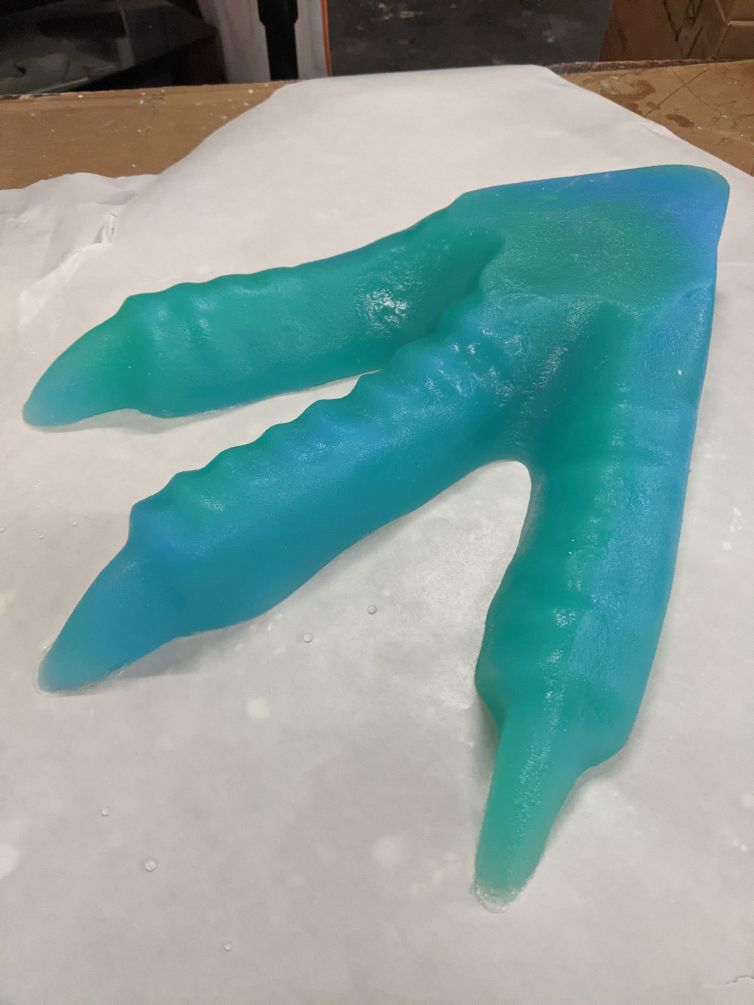 Resin cast of dinosaur foot for mini golf course