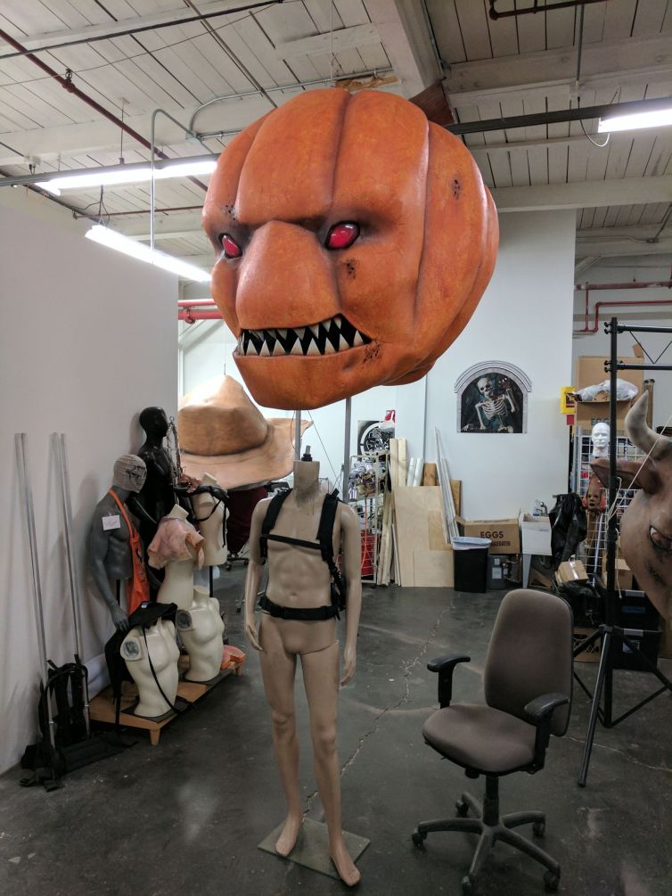 Giant pumpkin head backpack rig for parades