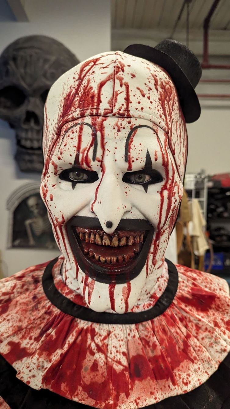 Art the Clown from Terrifier display, bloody clown mask, hat, and collar ruffle