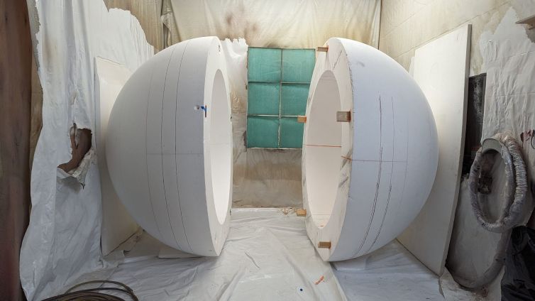 Alignment pegs and slots as the two halves of the giant foam ball are pulled apart and prepped for hard-coating