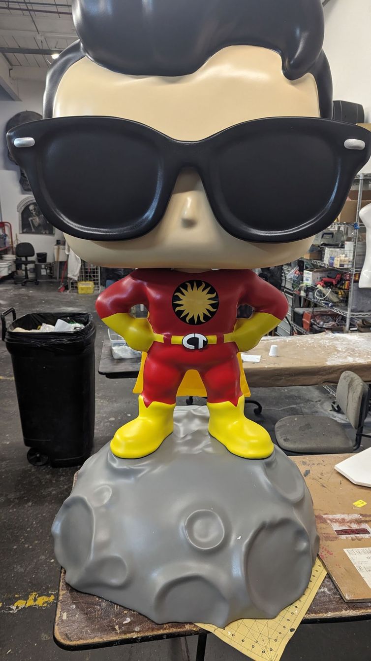 Completed Captain TerrifiCon Funko Pop style photo-op statue with swoop hair, glasses 3D printed belt buckle, and asteroid moon base