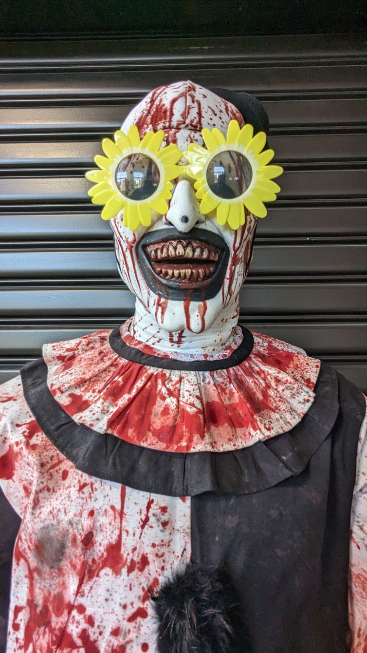 Bloody hyper-real Art the Clown photo-op and display with Sunflower sunglasses