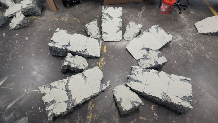 Cracked and broken concrete slab wedges created to simulate impact crater