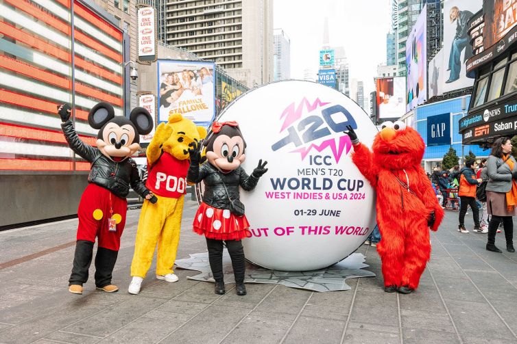 Typical NYC photo with Mickey, Minnie, Elmo, and Pooh in Times Square with giant T20 cricket ball photo-op promo