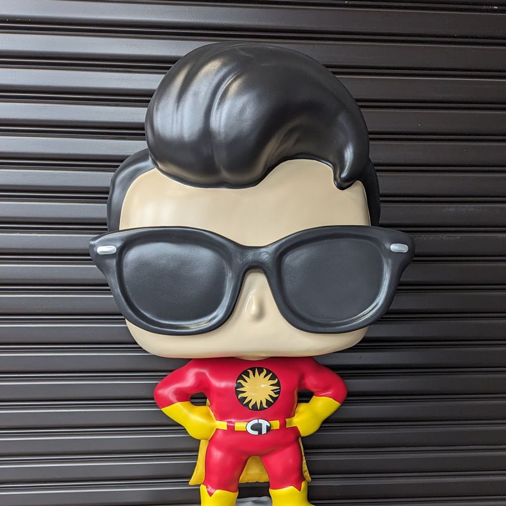 Main page image for the Captain TerrifiCon Funko Pop style photo-op statue with swoop hair, glasses 3D printed belt buckle, and asteroid moon base